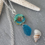 Handmade in Hawaii, Bohemian glass Hawaiian Flower bead with sea glass carved leaf, a beautiful necklace with matching earrings in my store