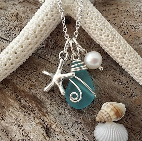 Handmade in Hawaii, Wire wrapped blue  sea glass necklace, Starfish charm, Fresh water pearl, . Beach jewelry gift.